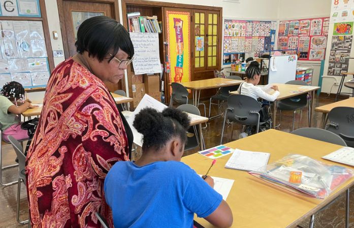  Academic Interventionist working with students in classroom